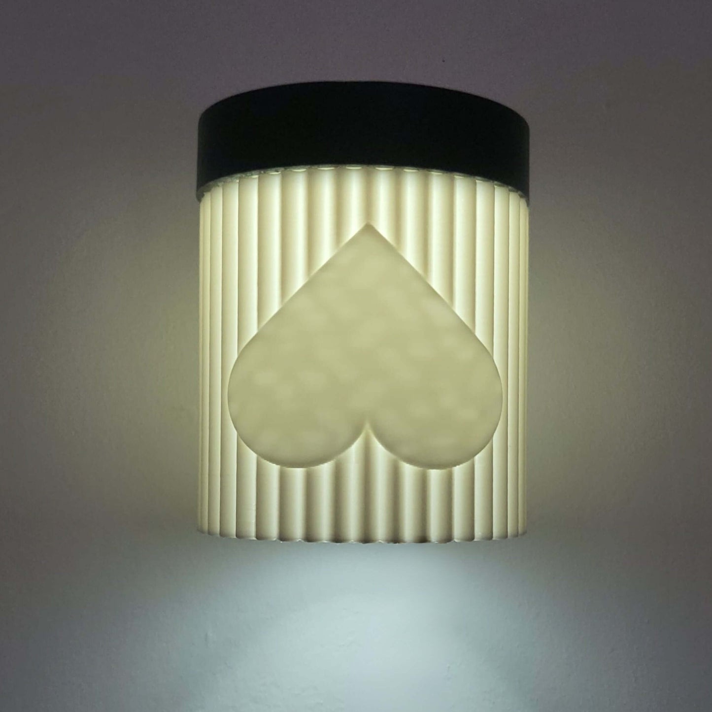 Wall-mounted light fixture with a unique design on a gray background