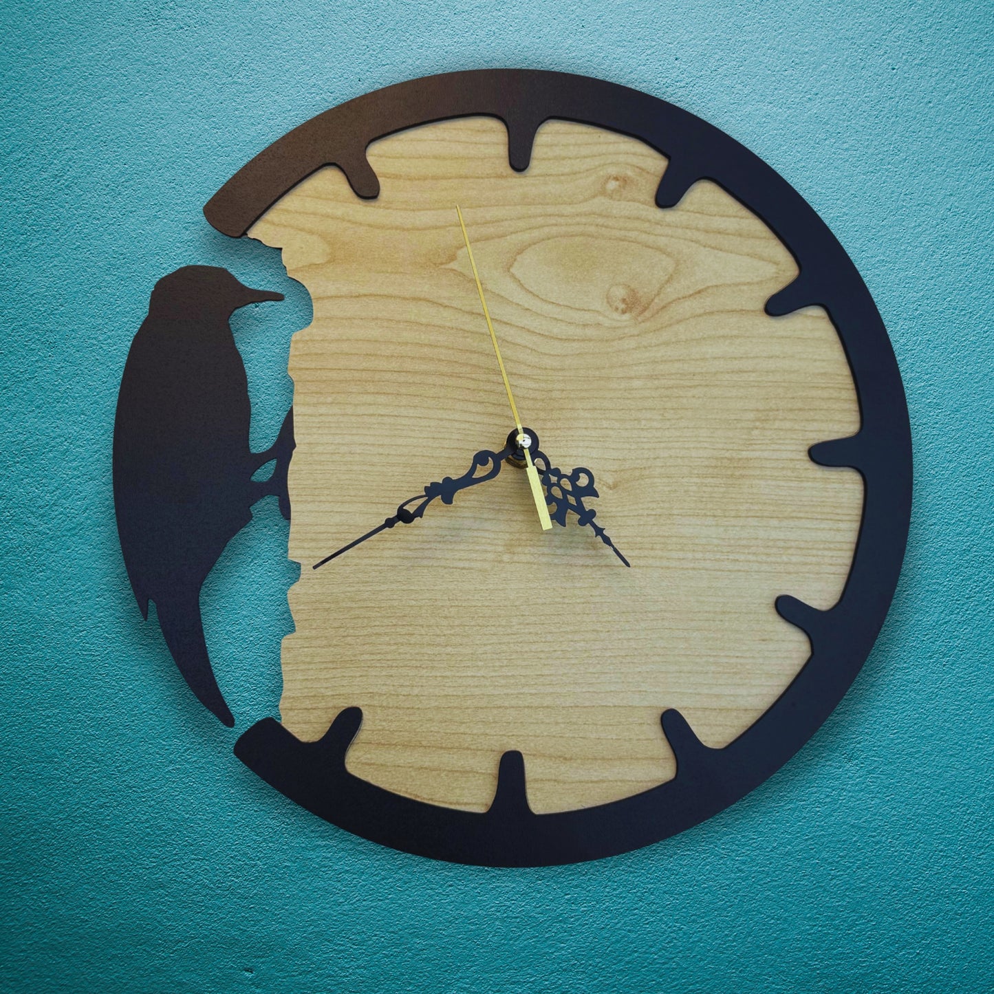 Wooden wall clock with bird silhouette on a blue background