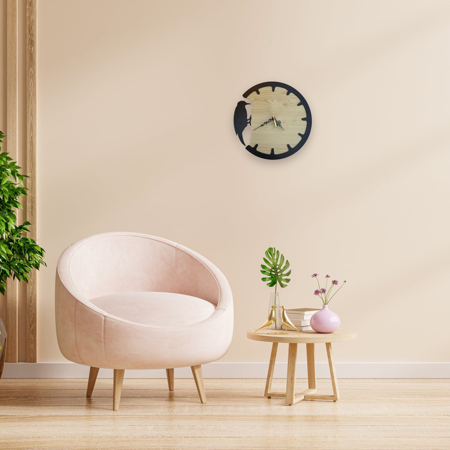 Modern living room with a pink armchair, small table, and decorative items.