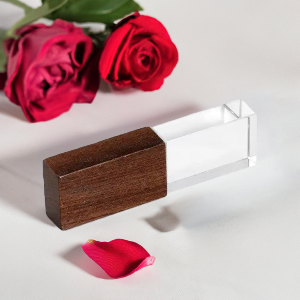 A hand holding the USB drive, demonstrating its compact size and stylish design, making it the perfect blend of practicality and elegance.
