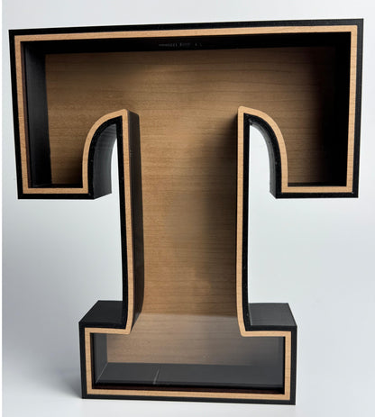 Wooden letter 'T' with a black frame on a white background