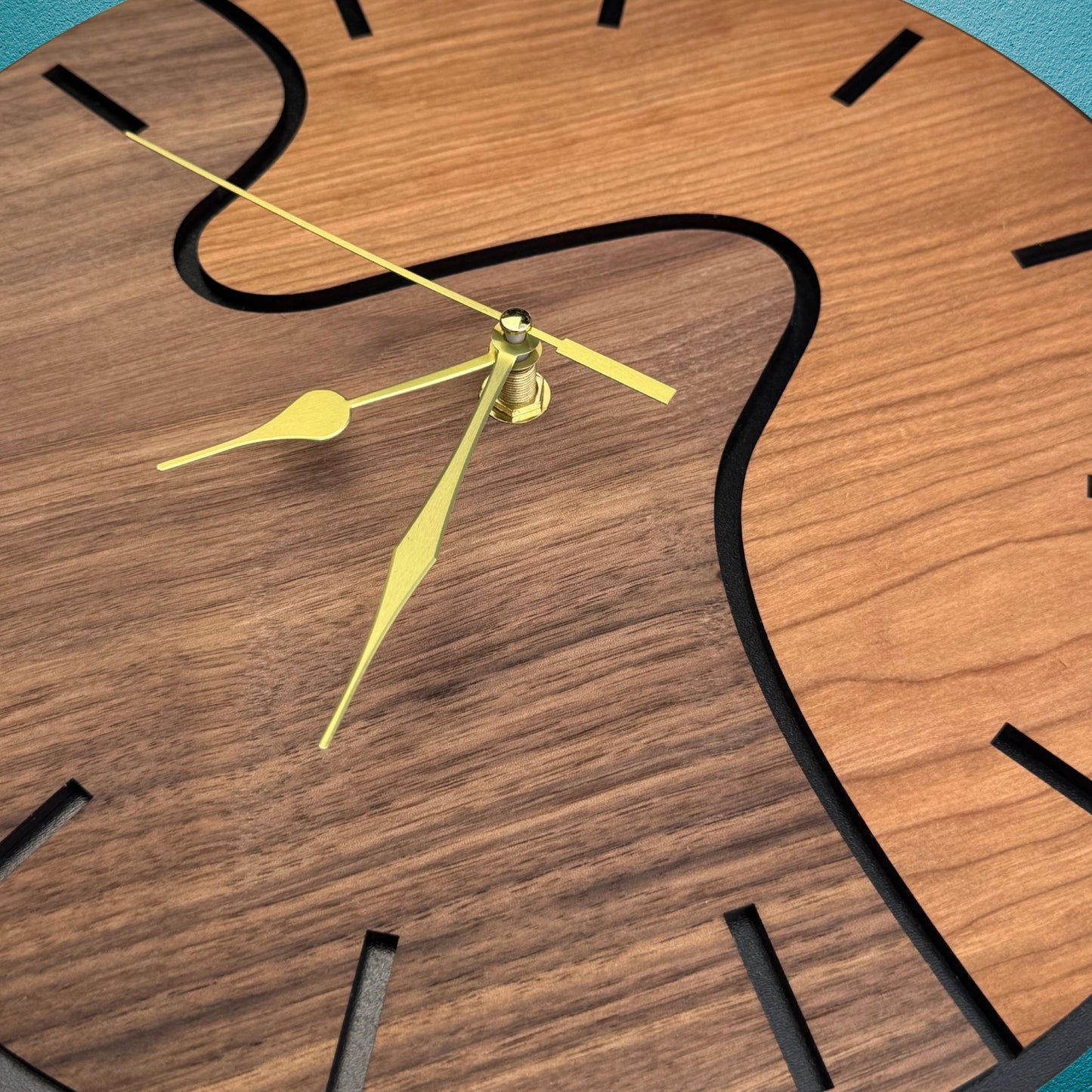 Wooden clock with yellow hands on a blue background