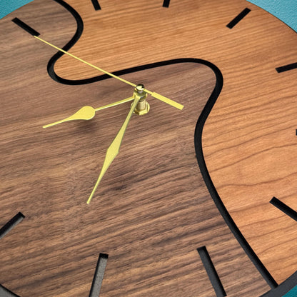 Wooden clock with yellow hands on a blue background