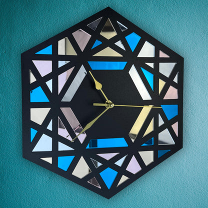 Geometric wall clock with a black frame on a teal background