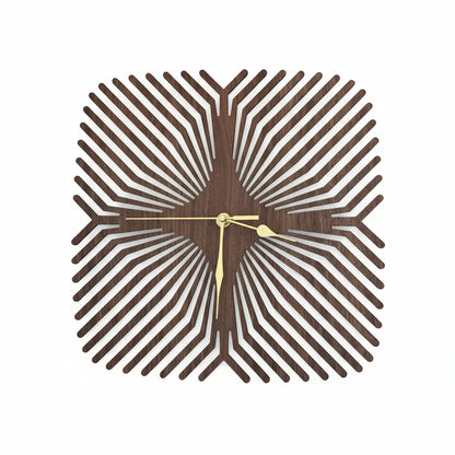Decorative wall clock with a geometric design on a white background