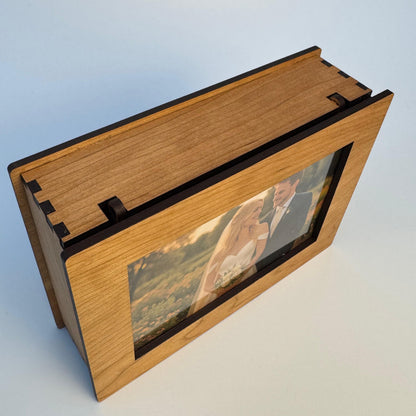 Wooden photo album with a clear cover on a light gray background