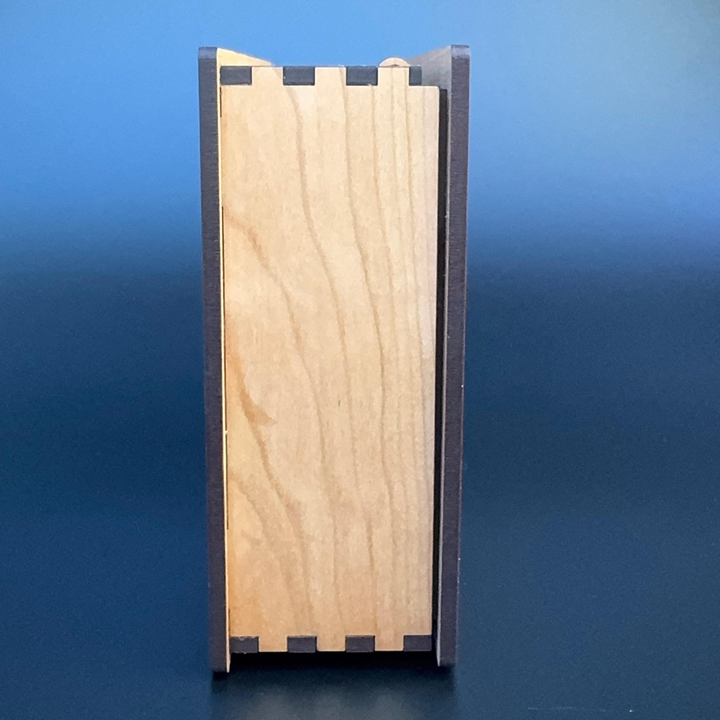 Wooden box with a blue gradient background