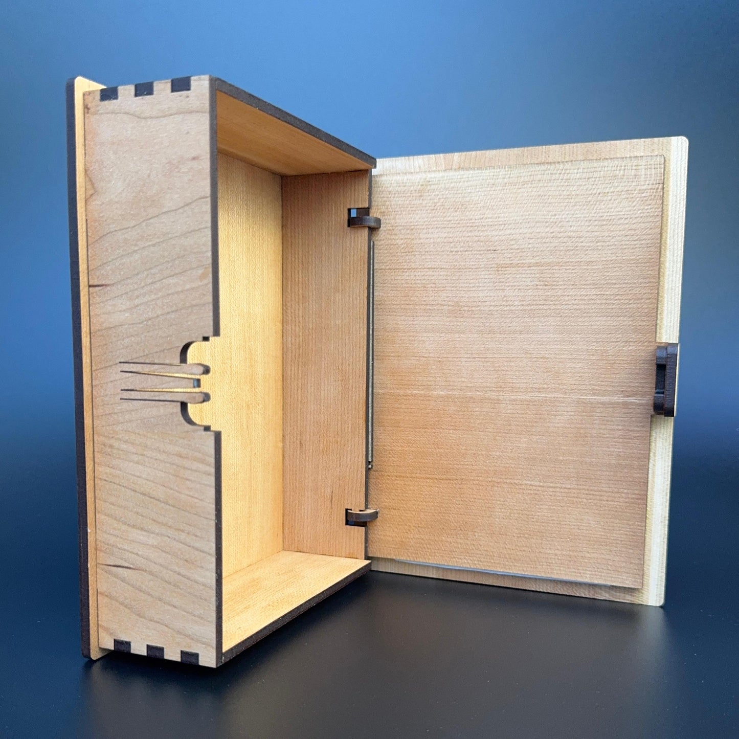 Wooden box with open lid on a blue background