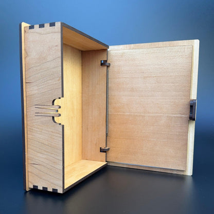 Wooden box with open lid on a blue background
