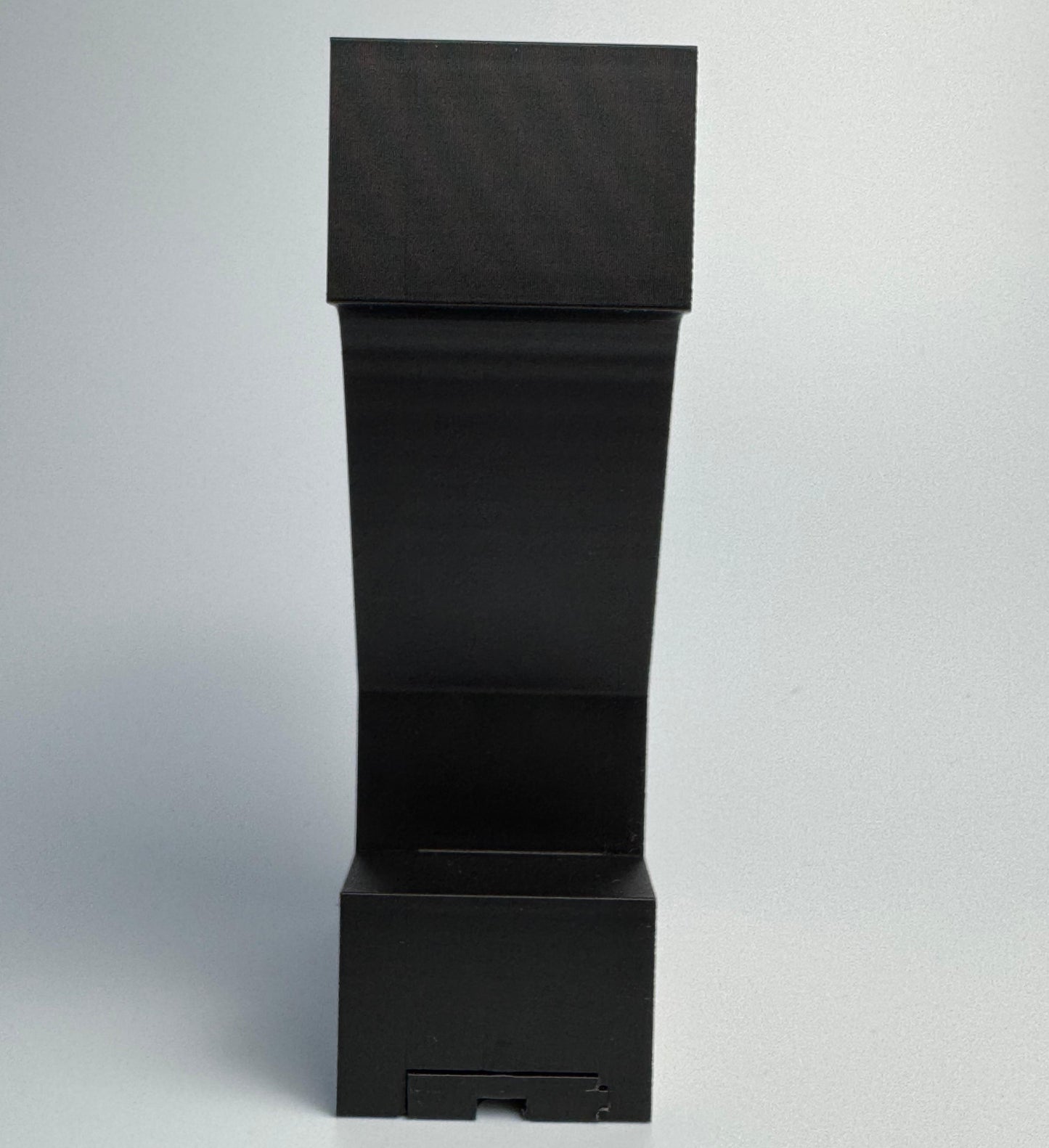 Black rectangular box with a smaller square cutout on a white background