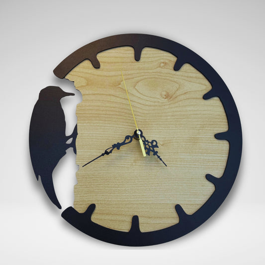 Wooden wall clock with black silhouette design on a white background