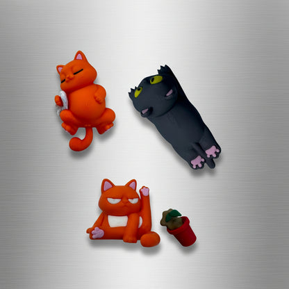 Four cat-shaped figurines in different poses on a white background