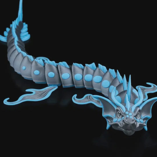 Close-up of the Abyssal Dragon showing its intricate scales, smooth 3D-printed texture, and moveable limbs designed for customizable posing.