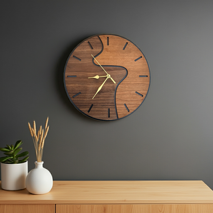 Wooden wall clock on a gray wall with a wooden shelf and decorative items.